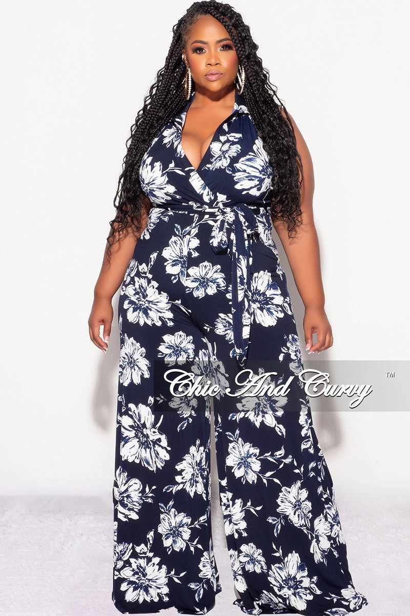 Form Fitting Final Sale Plus Size Faux Wrap Halter Jumpsuit with Waist Tie in Navy and White Floral Print