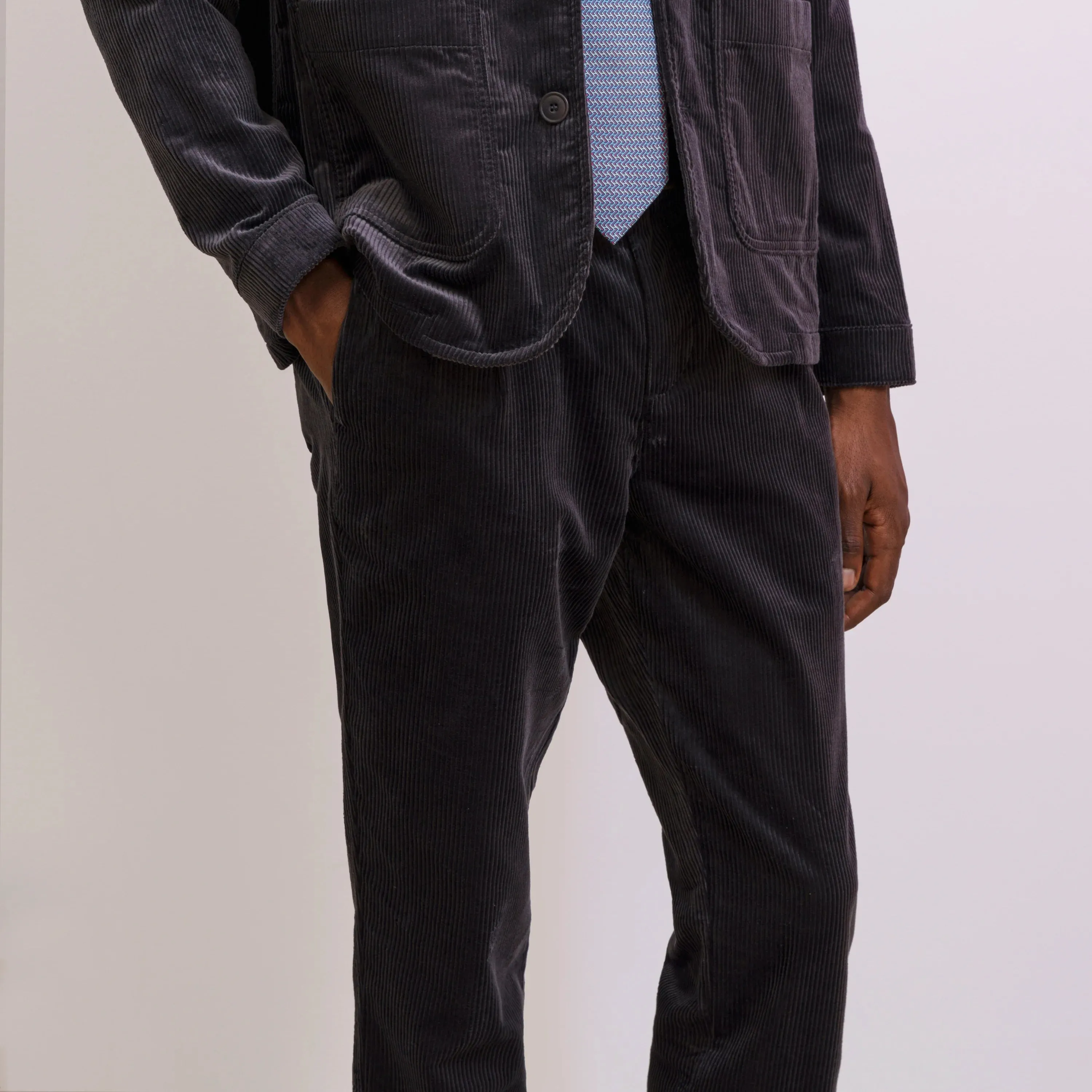 PLEATED CORDUROY TROUSERS
