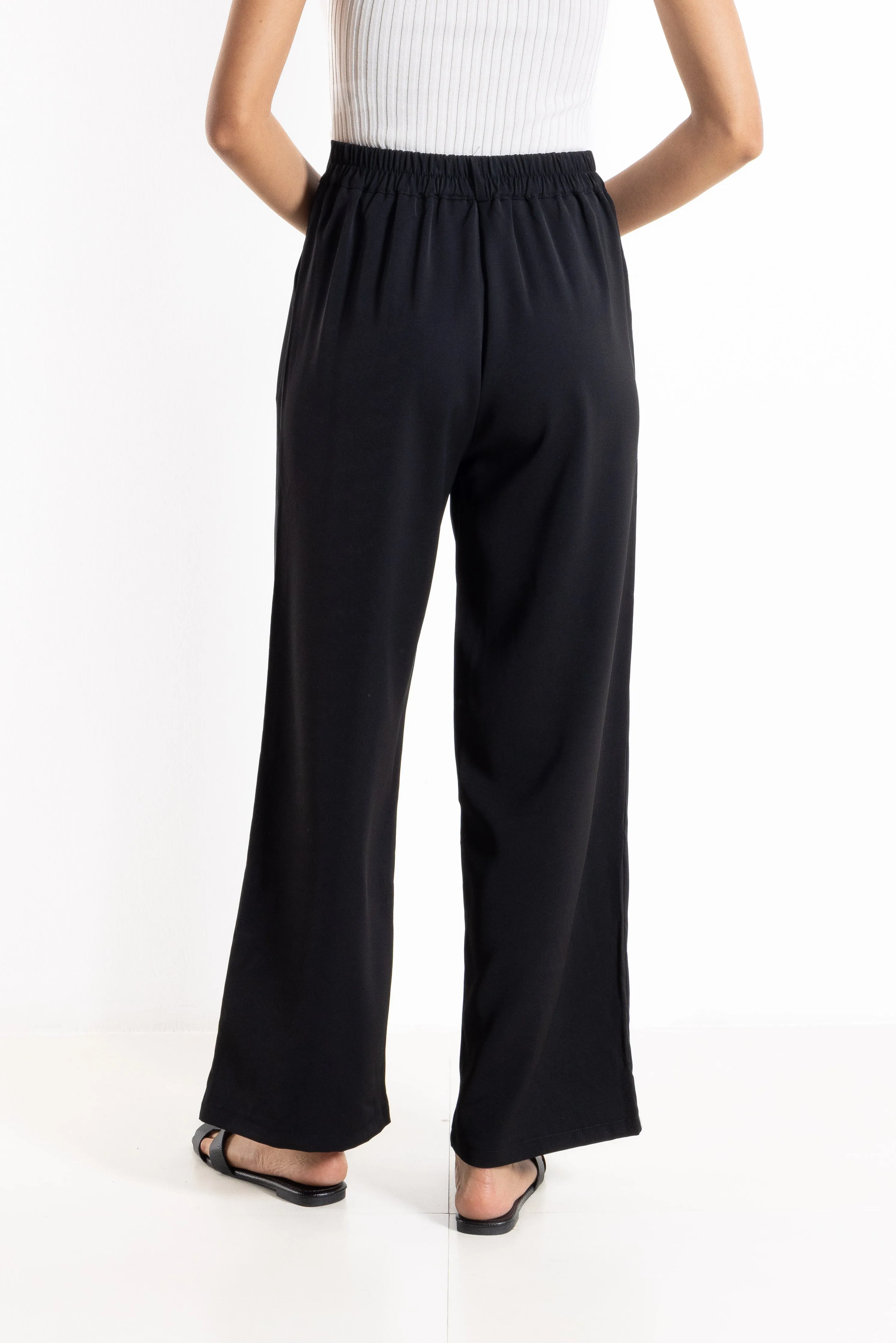 PLEATED HIGH-WAIST TROUSERS