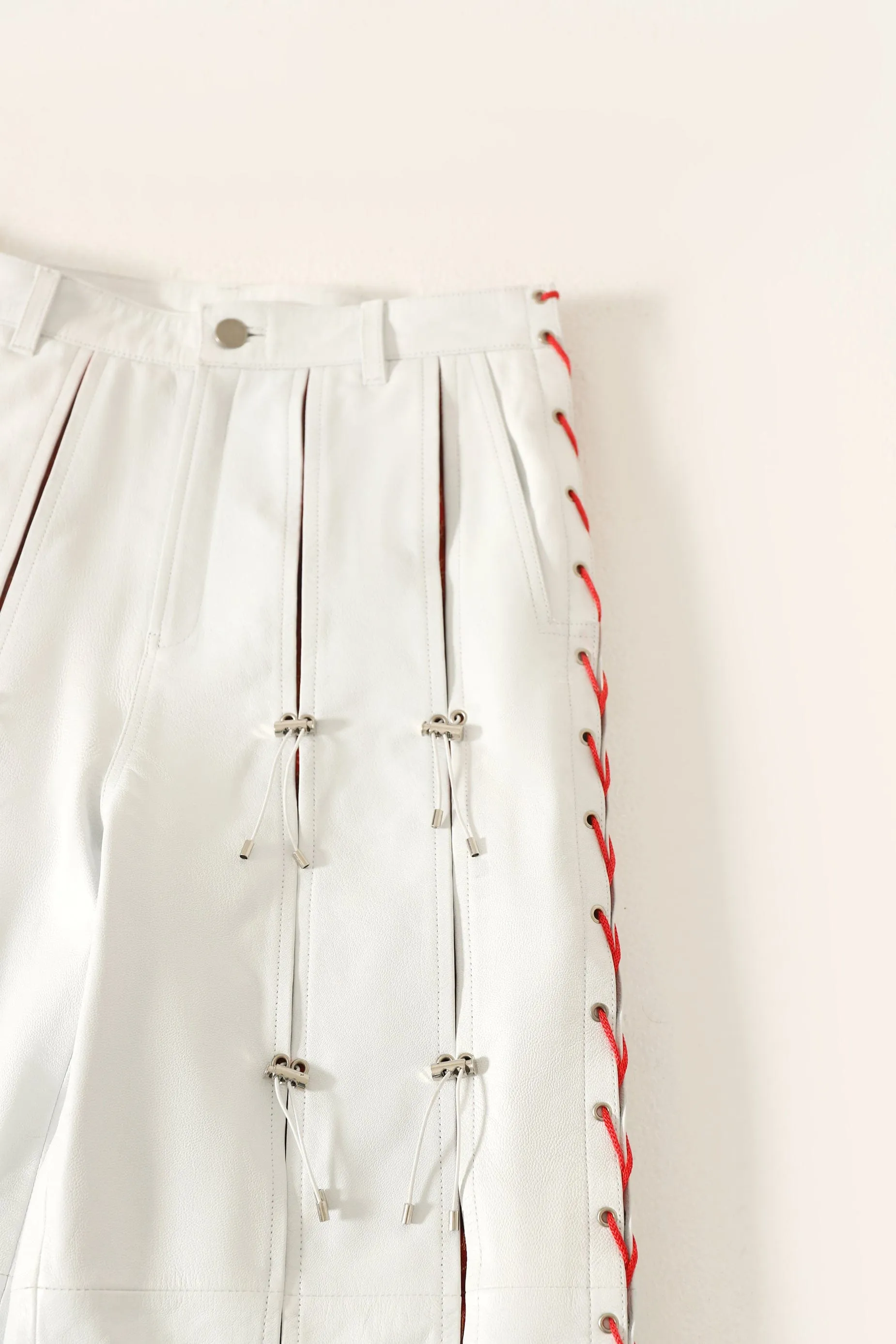 PLEATED LEATHER TROUSERS